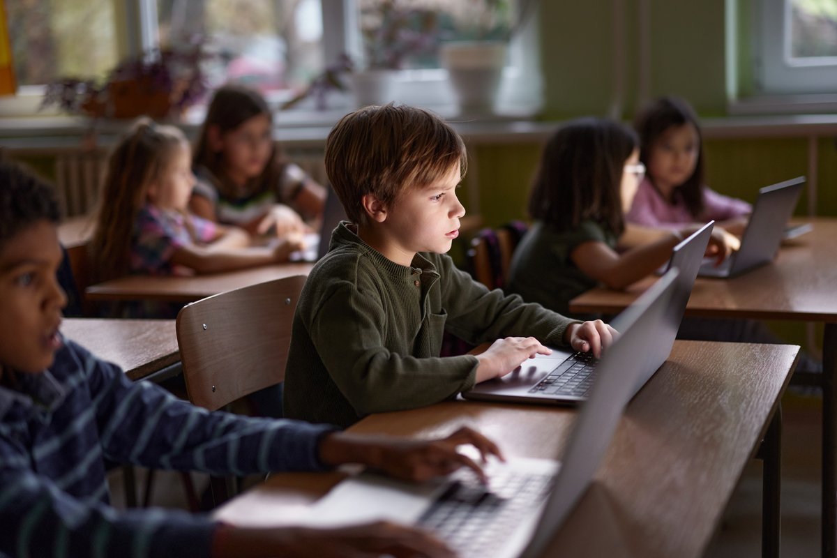 Kids on laptops in school