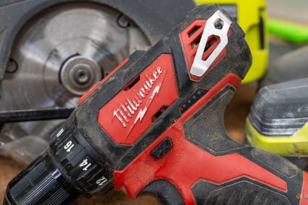 milwaukee m12 drill driver close up with ryobi circular saw behind 1