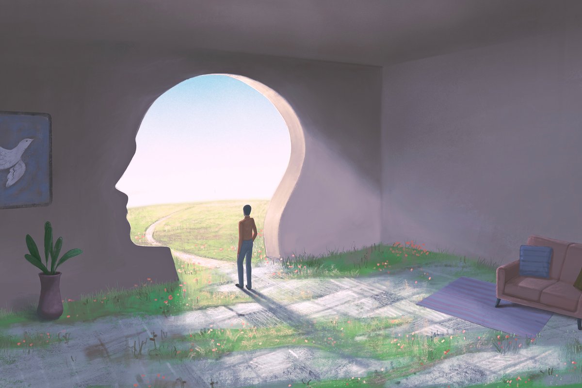 person looking out from room through head shaped passageway
