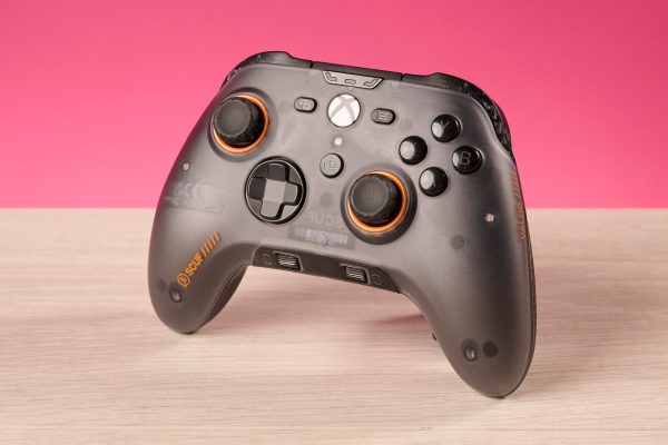 The Scuf Valor Wired with TMR in front of a pink background.