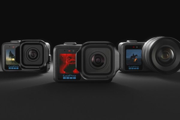 All three of the GoPro Mission 1 series of action cameras side by side over a dark studio background