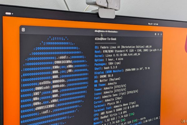 a pc monitor with a linux terminal open showing the fastfetch output for fedora 1