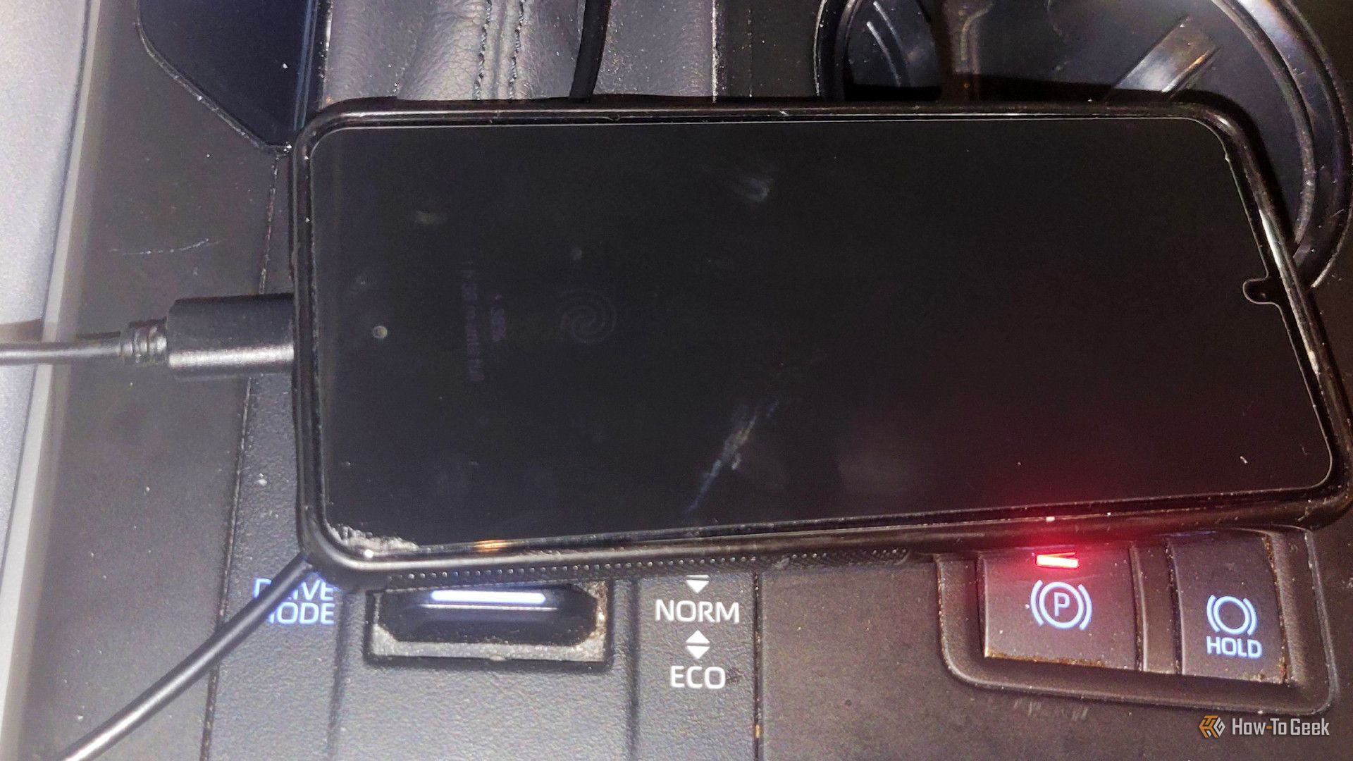 a usb plugged intoa phone in a car 2