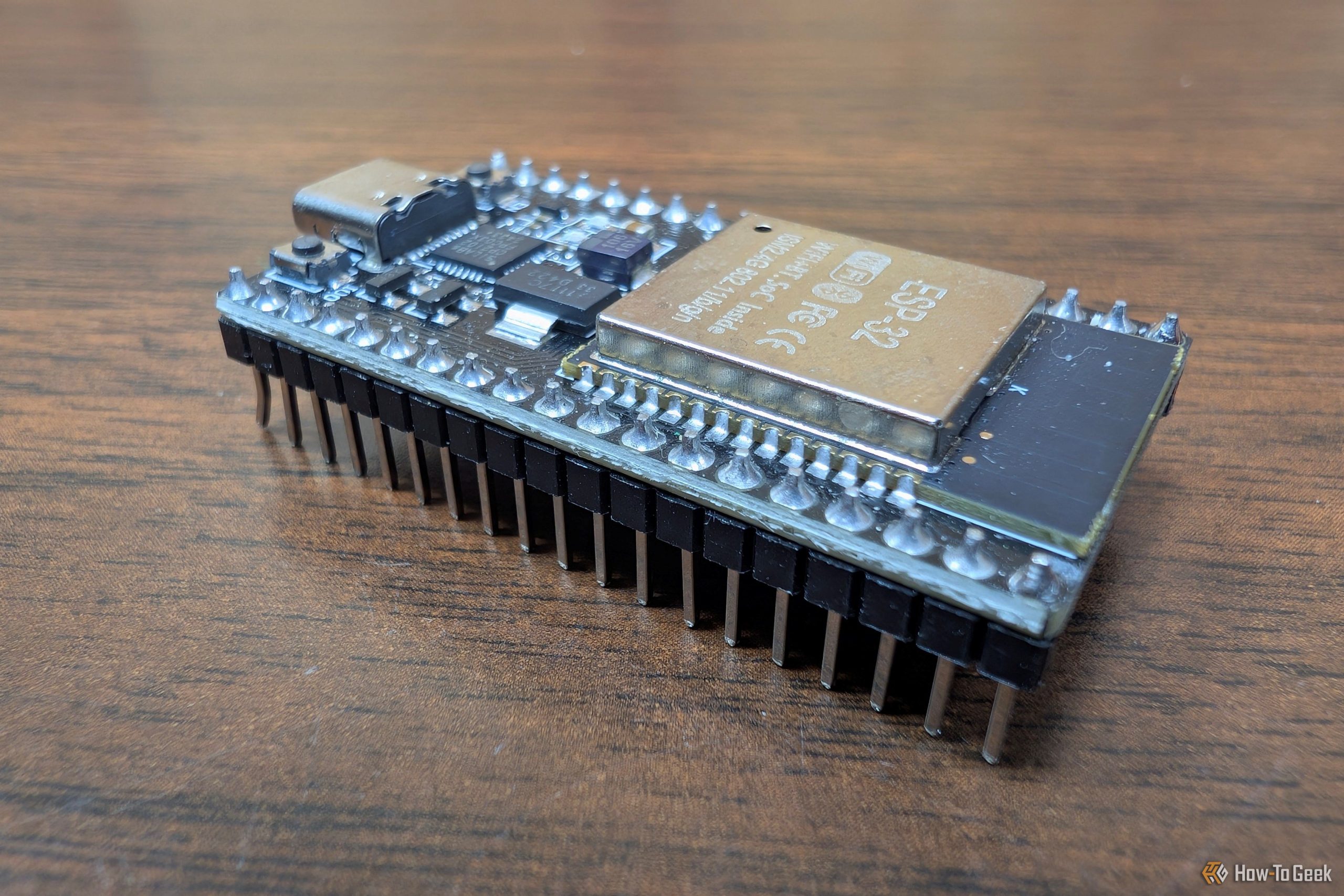 esp32 dev board on wood desk scaled