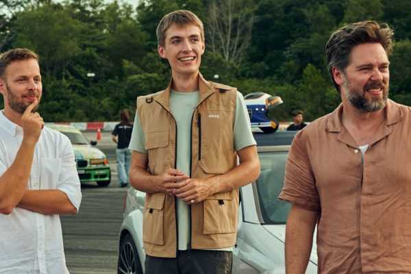 James, Francis and Thomas look at something on a racetrack