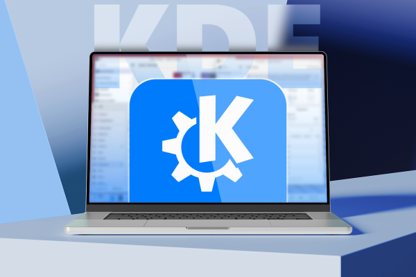 laptop showing the kde logo on screen with a blue and purple background and kde in large letters behind it