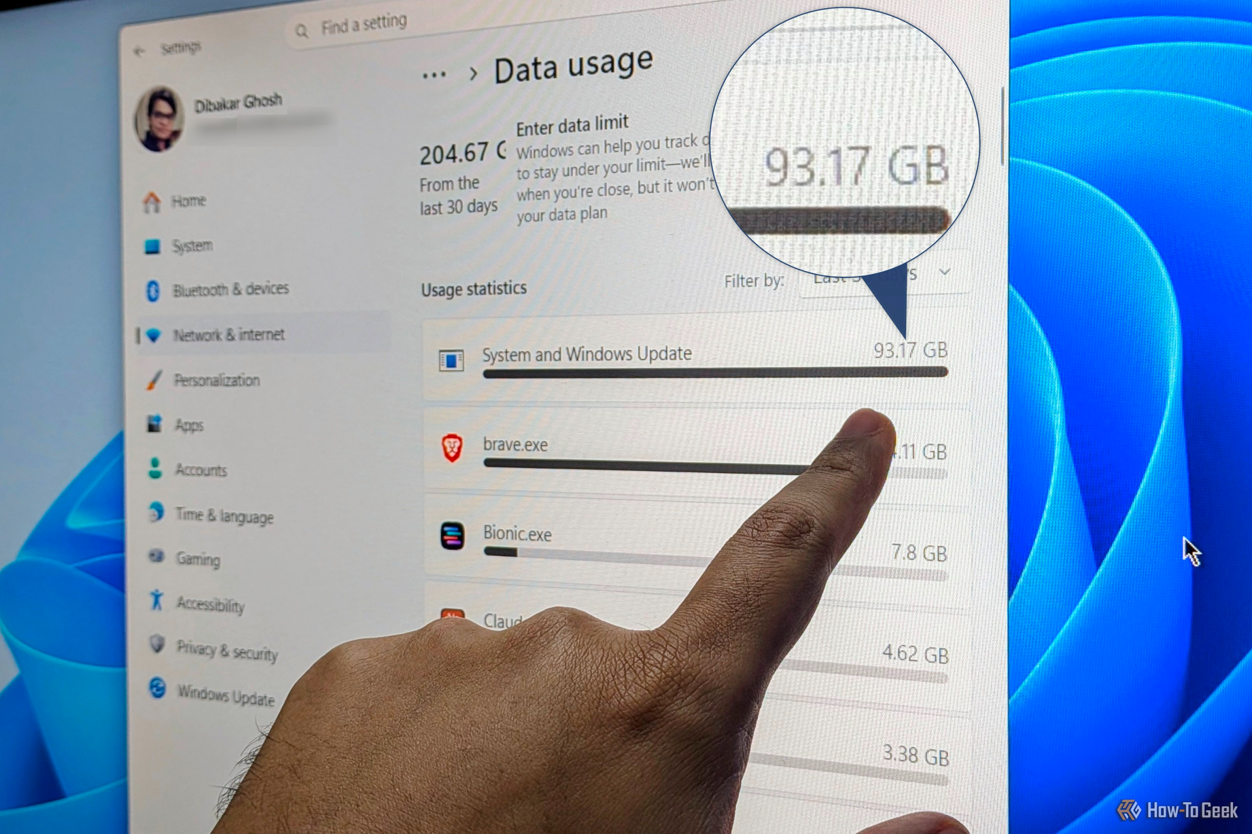 my finger pointing at windows data usage setting showing high 93gb usage by system and windows updates scaled