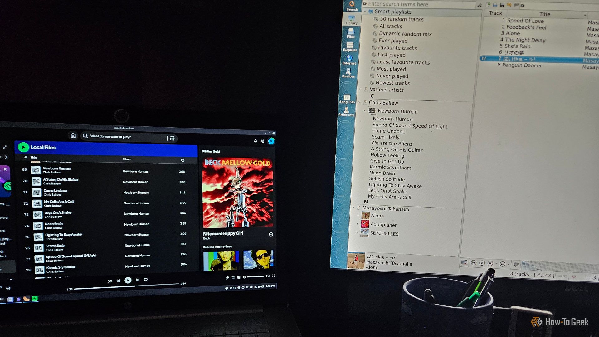 spotify and clementine open side by side on two different monitors