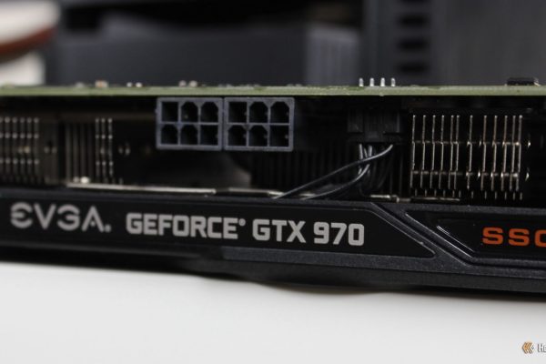 the side of the evga nvidia geforce gtx 970 ssc gaming acx 2 0 graphics card sitting on a desk