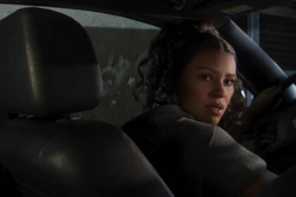Lucia looks over her shoulder from the driving seat of a car, from the GTA 6 extended look